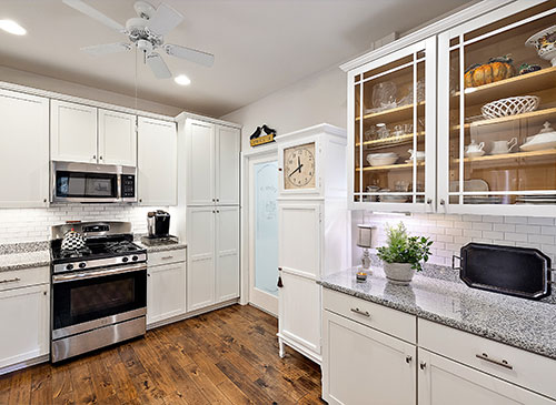 a large kitchen with stainless steel appliances