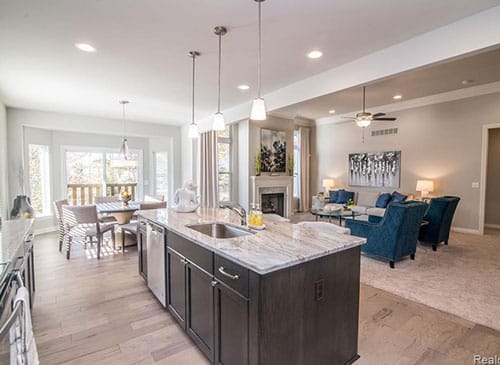 a large kitchen with an island in the middle of a room