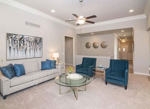 a living room filled with furniture and a fireplace