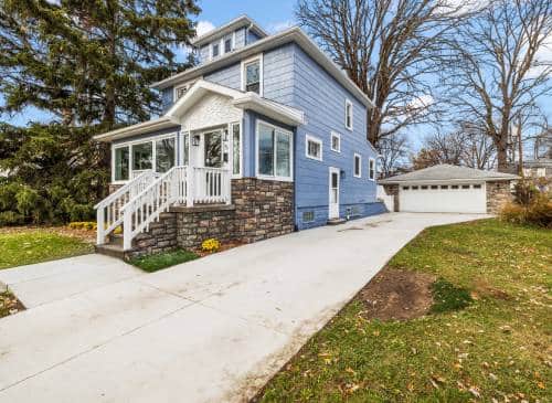 a house with a lawn in front of a building