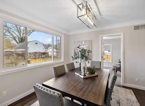 a living room filled with furniture and a large window