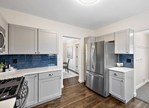 a large kitchen with stainless steel appliances