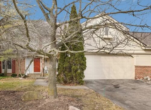 A Tree In Front Of A House