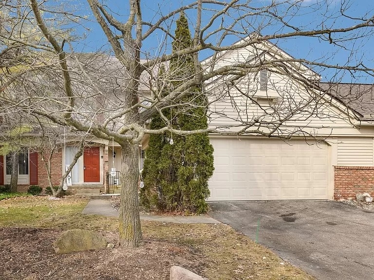 a tree in front of a house