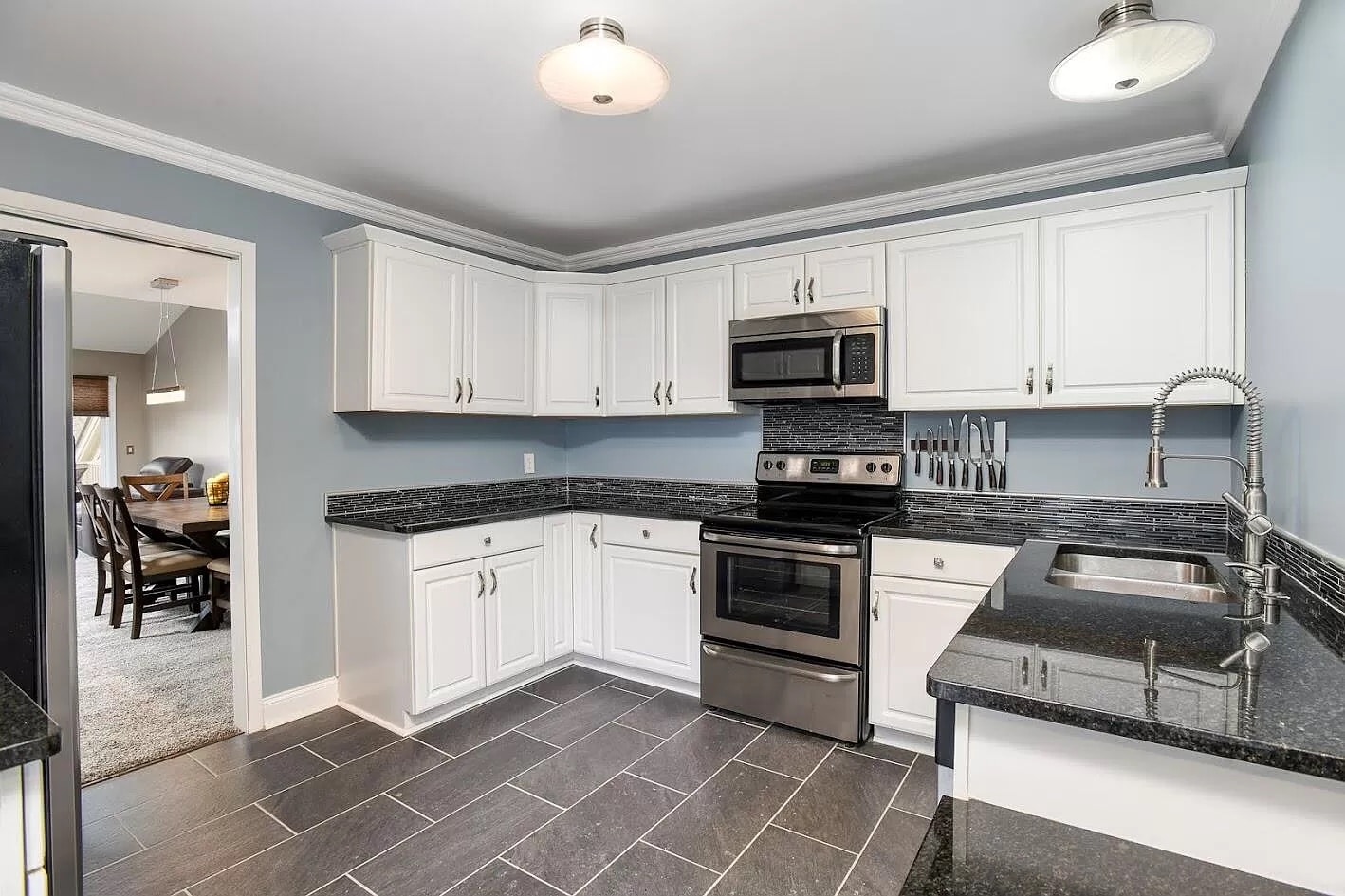 a kitchen with a stove top oven