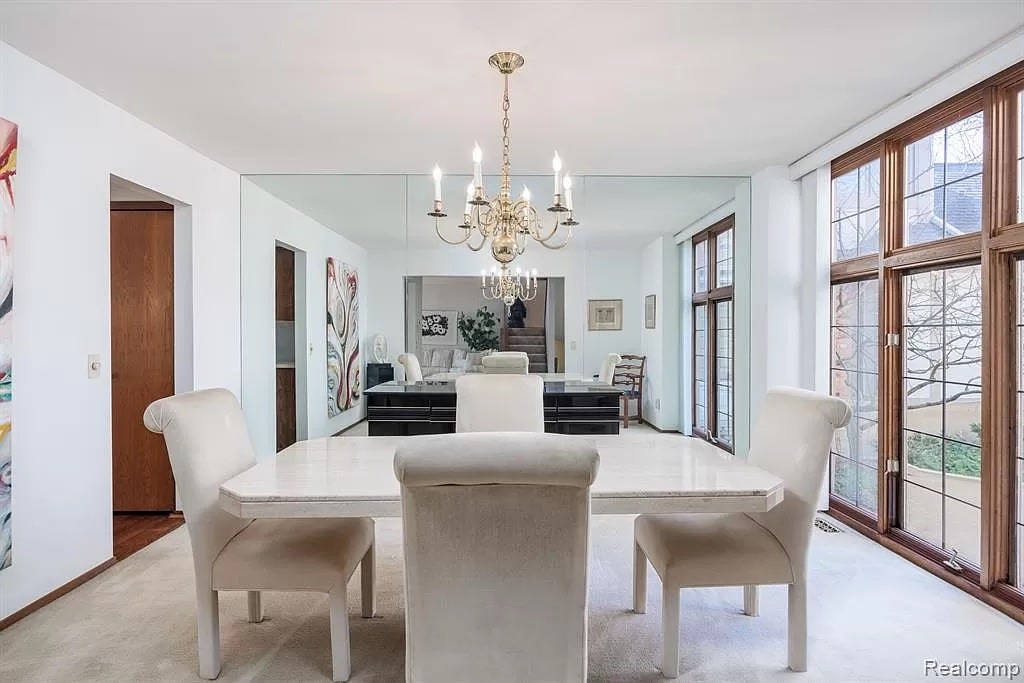 a living room filled with furniture and a large window